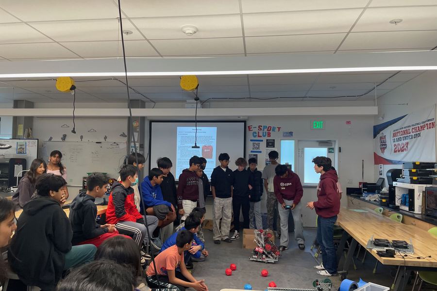 Team members answering questions from middle schoolers