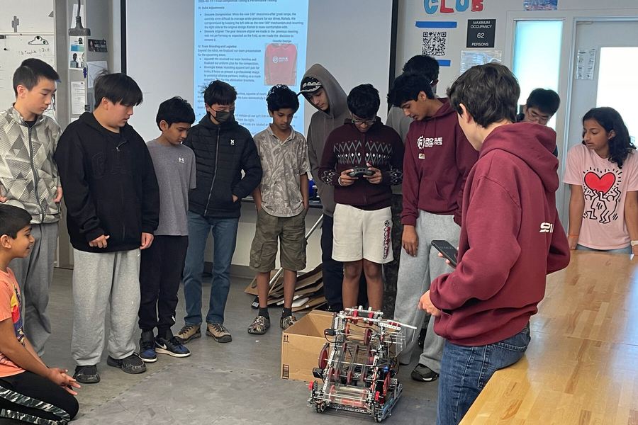Students crowding in for a closer look at the robot
